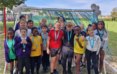 Students stood with their medals