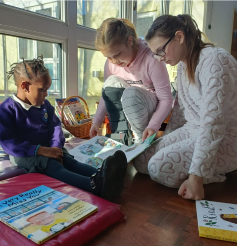 Students reading books together