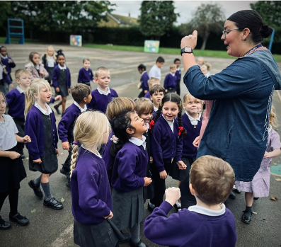 Students with a teacher on a playground