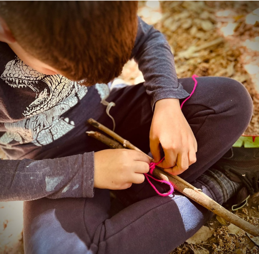 Student partaking in a forest school lesson