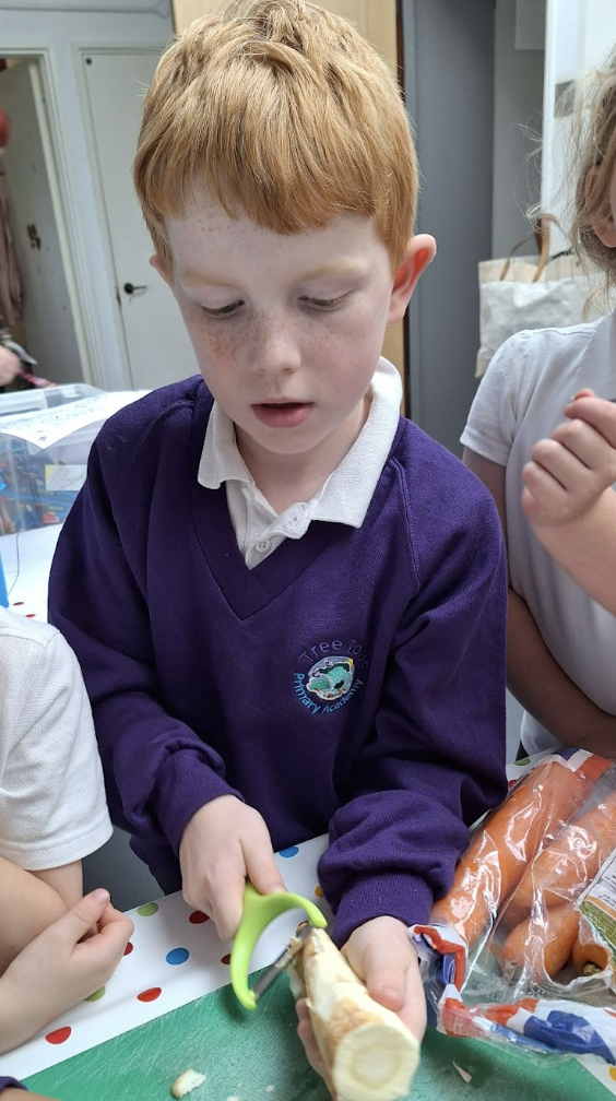 Student peeling a vegetable