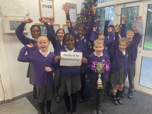 Pupils at Leigh Academy Tree Tops are pictured celebrating and smiling for the camera, as they announce that their school is read to be judged 'Outstanding' by Ofsted.